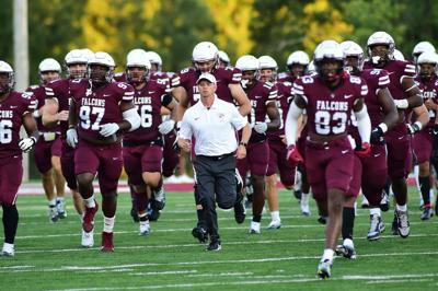 FSU Coach and charges head onto the field to open the Fighting Falson season.JPG